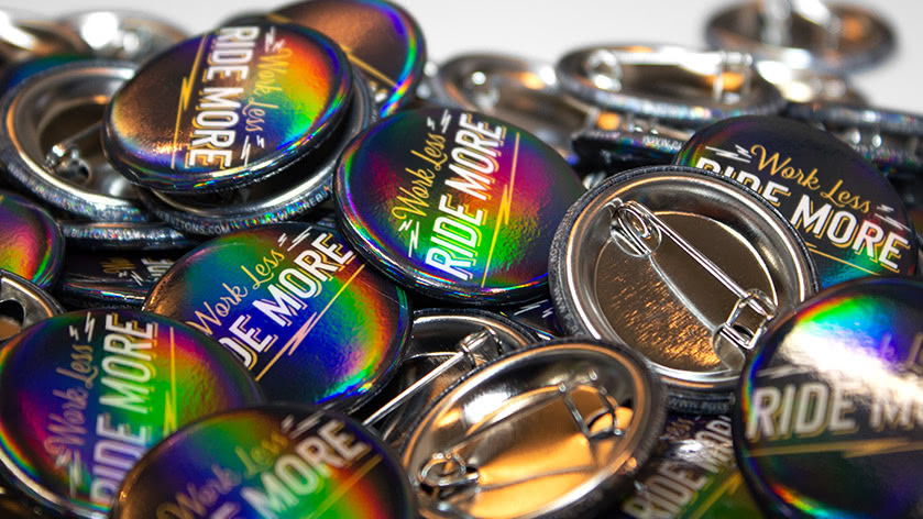 Work Less Ride More 1.25" Round Custom Buttons with Rainbow Gloss Finish