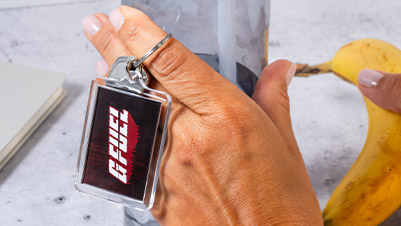 Hand Holding G FUEL Keychain and Keys