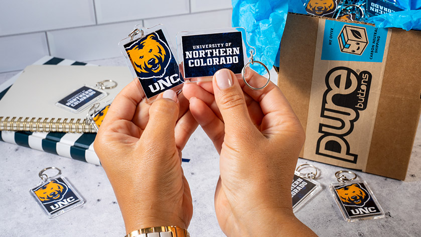 Unboxing custom rectangle keychains for Univesity of Northern Colorado