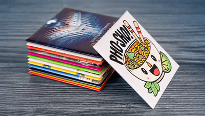 A Stack of 2.5 Inch Square Fridge Magnets with Artwork That Reads Pho-Sho!