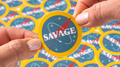 Hands Holding a Circle Sticker Printed for Adam Savage of Mythbusters
