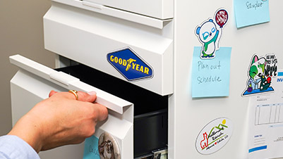 Custom Shape Magnets Attached to a Filing Cabinet