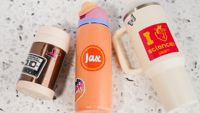 Custom Glitter Stickers applied to water bottles