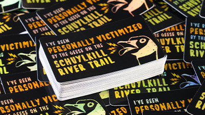 Rectangle Holographic Stickers that Read "I Was Personally Victimized by the Geese on Schuylkill River Trail"