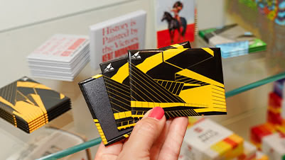 A Variety of Custom Stickers and Sticker Packs Printed for Akron Art Museum on Display in the Gift Shop