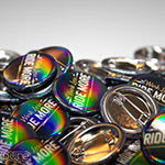Work Less Ride More 1.25 Inch Pin-Back Buttons with Rainbow Gloss Finish Closeup